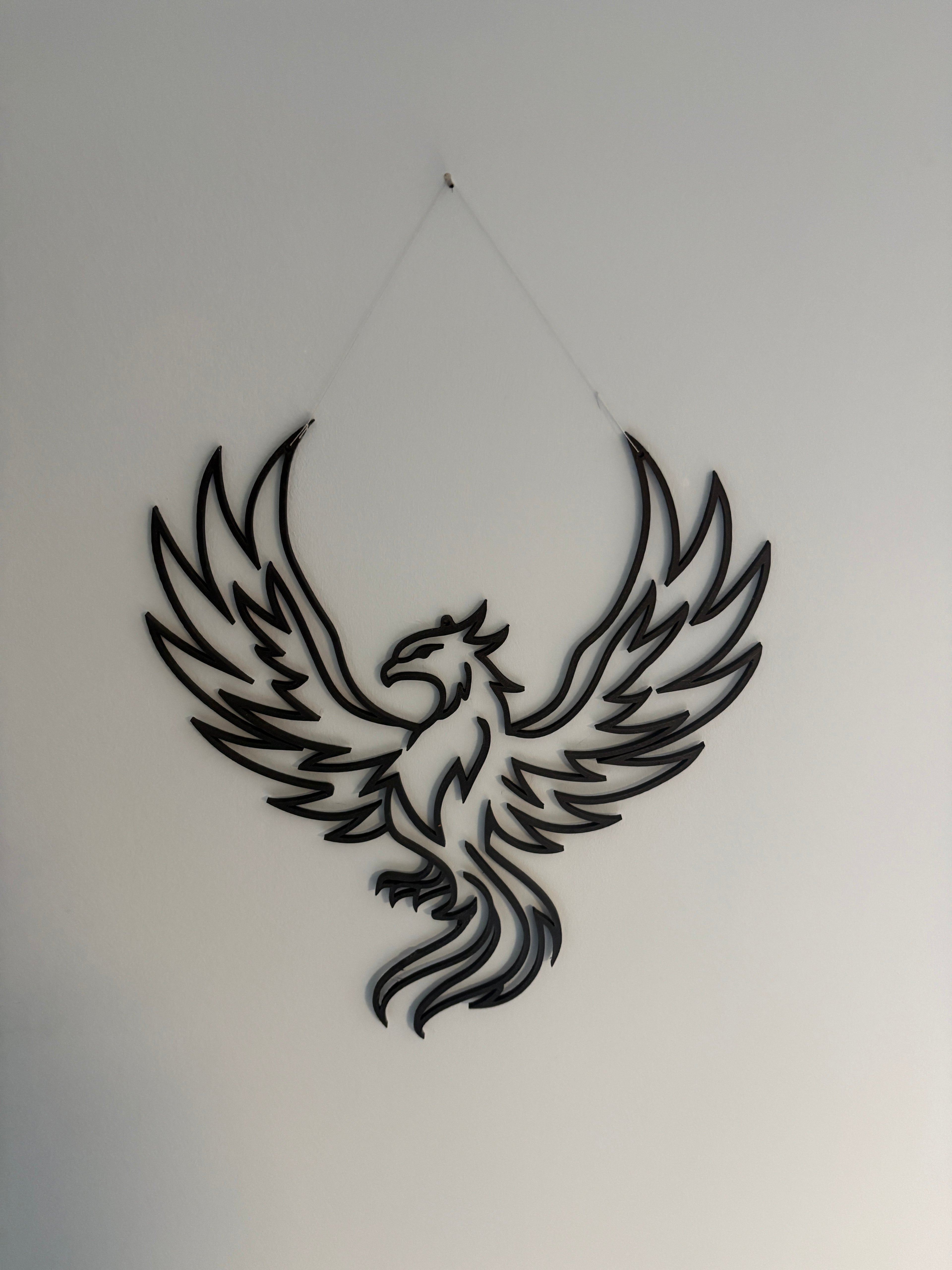 3D printed phoenix wall decoration, in a modern, clean style.